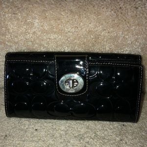 Coach black patent leather "C" monogrammed wallet.